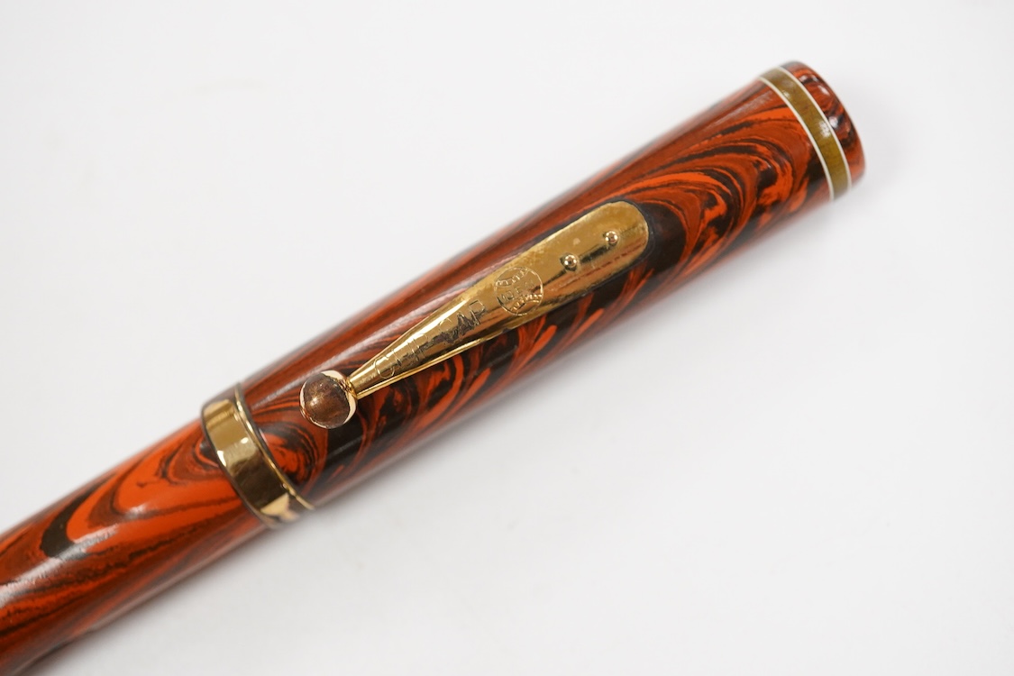 A Waterman Red Ripple No.7 lever filler with yellow cap band and fitted with a Waterman nib